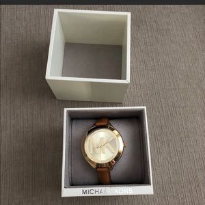 Michael Kors watch leather runway.